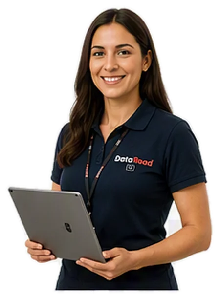 Woman in a navy DataRoad polo shirt, holding a silver laptop and smiling.